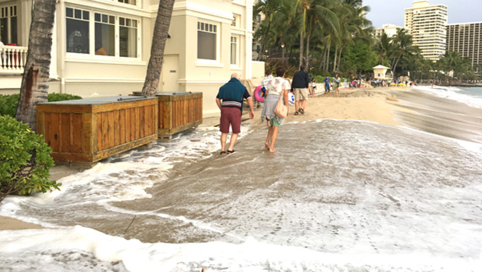 High waves on the beach by the Moana Surfrider
