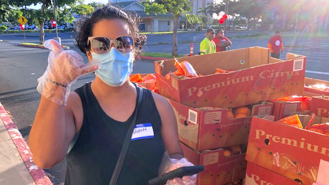 woman by orange crates