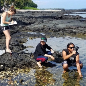 students taking water sample