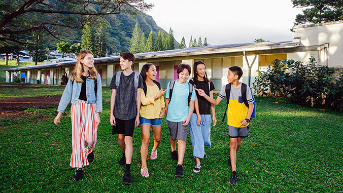 students talking and walking