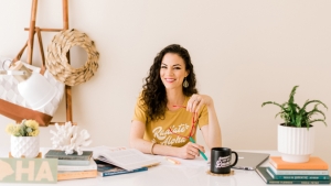 person sitting at a table and smiling