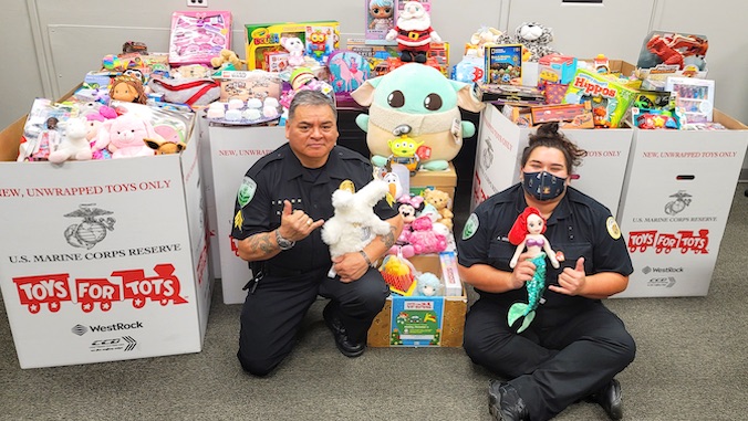 officers in front of toy donations