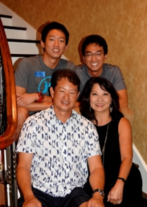 four people smiling at the camera