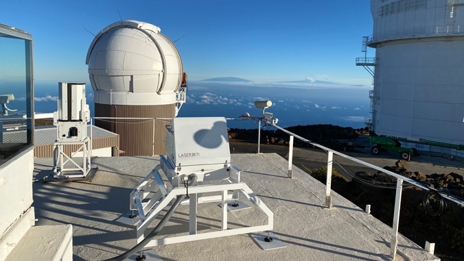 LaserSETI devices with telescope in background