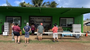 people looking at a green building