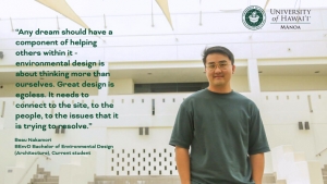 man smiling in front of building