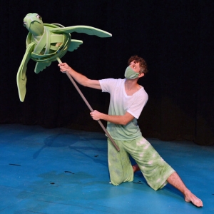 actor holding turtle pupped