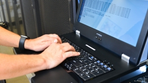 Hands typing at a keyboard