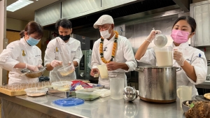 4 chefs in a kitchen