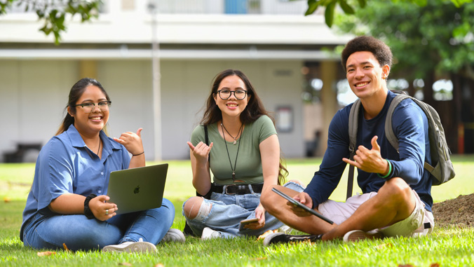 Three smiling students
