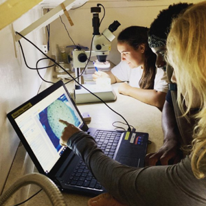 students working on computer