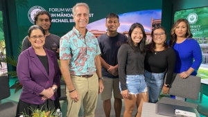 people standing and smiling at the camera
