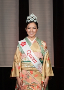 person in a kimono smiling at the camera