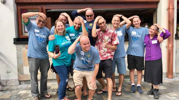 people smiling with bald heads
