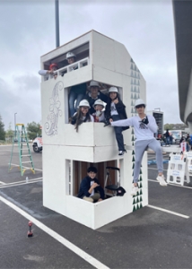 people with hard hats near a structure