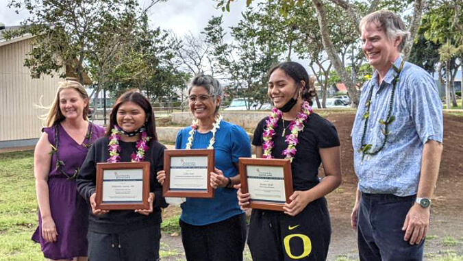 students holding certificate