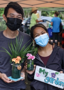 people smiling with their plants