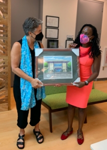two women holding frame