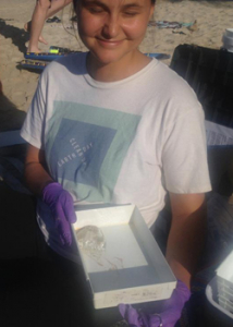 woman holding a jellyfish in a box