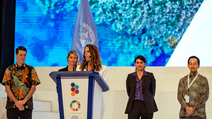 people at the podium accepting award