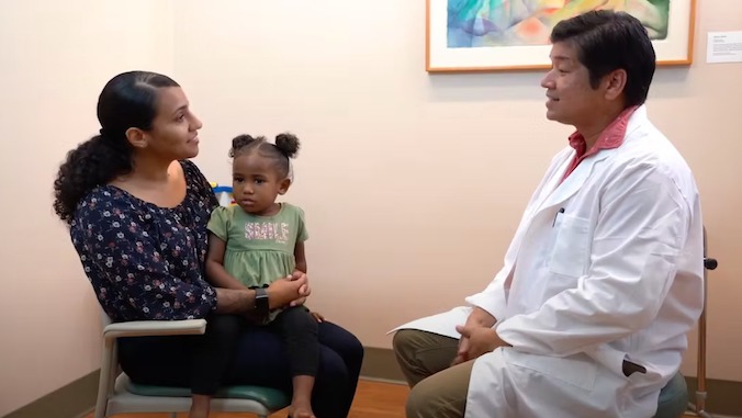 mother and child meeting with doctor