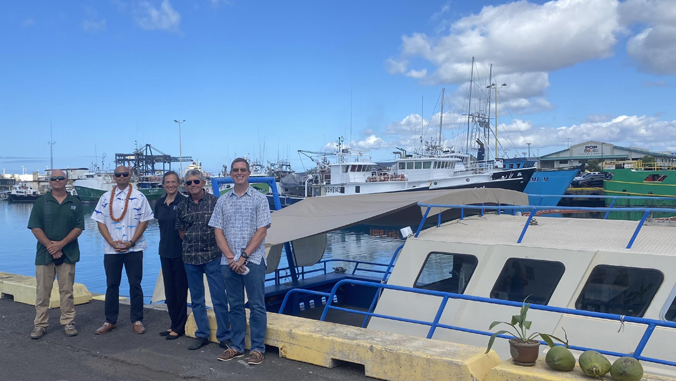people standing by boat