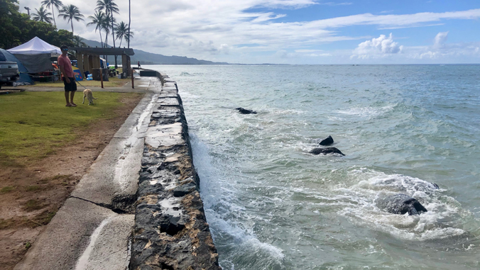 photo of ocean and rock wall