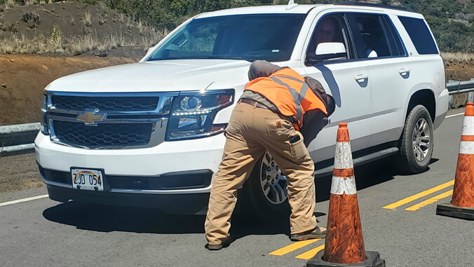 Ranger checking a vehicle