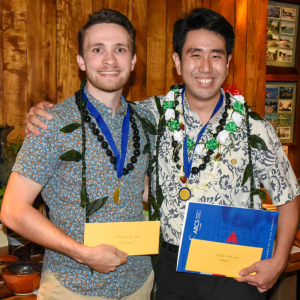 two people holding award