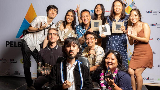 Group of people holding awards