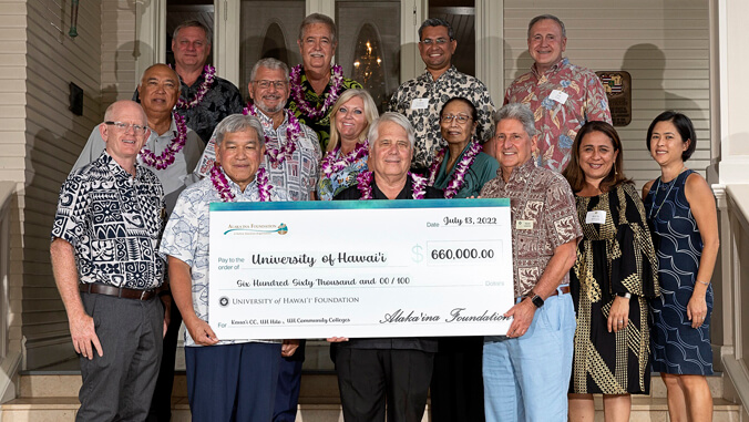 people holding big check