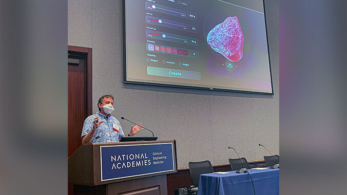 person standing at a podium with a presentation in the background