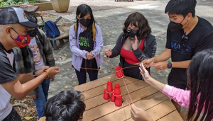 students cup team building activity