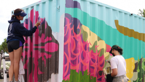 students painting mural