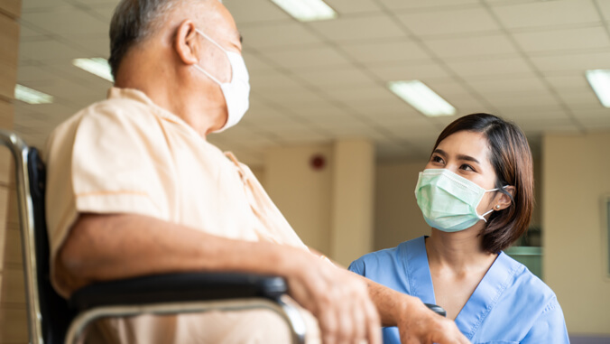 nurse helping patient