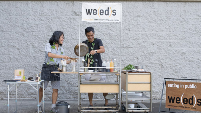 two people cooking