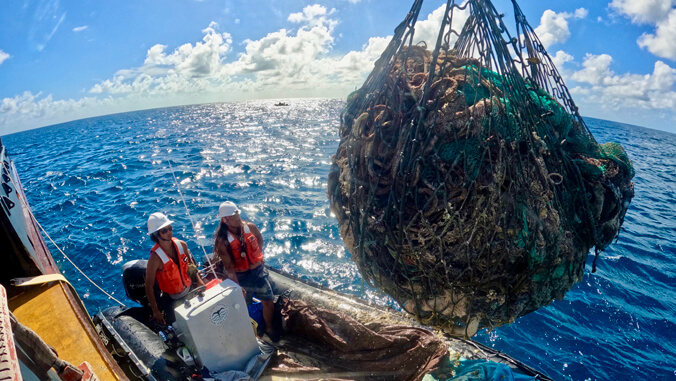 big ball of nets above a boat