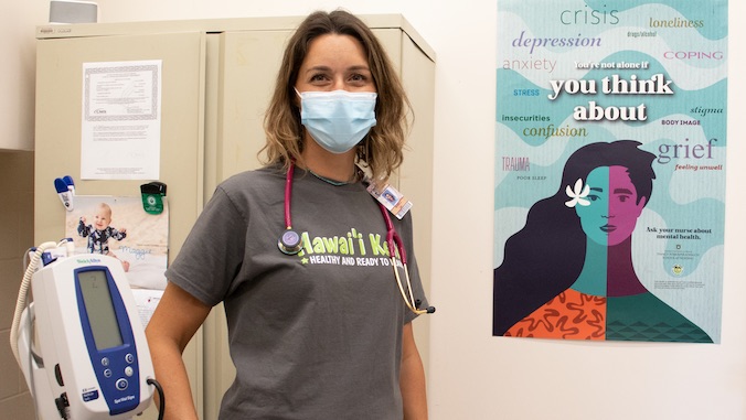 nurse next to poster