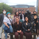 Group of students with a statue of Shakespeare