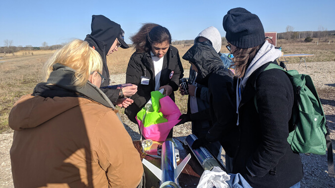 students assembling a rocket