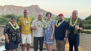 group photo with diamond head in background