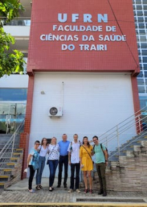 researchers in front of building