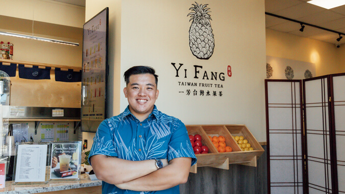 person with a blue shirt posing for the camera