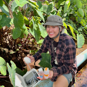 man smiling with water sample