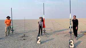 people standing by rockets