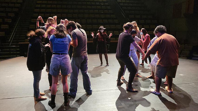 People rehearsing on stage