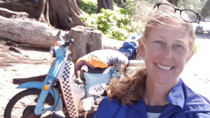 person standing in front of a motocycle