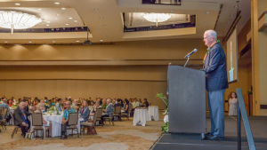 person speaking at a podium