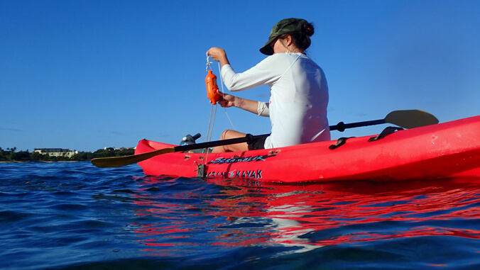 women in kayak on the water