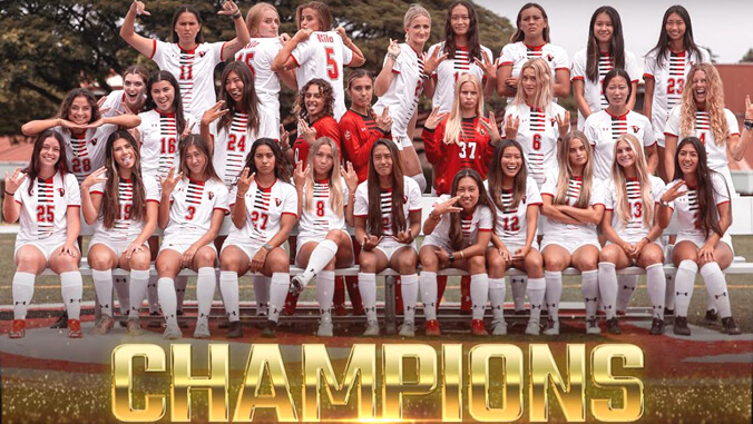 U H Hilo soccer players champions graphic